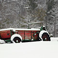 Red Farm Implement in the Snow